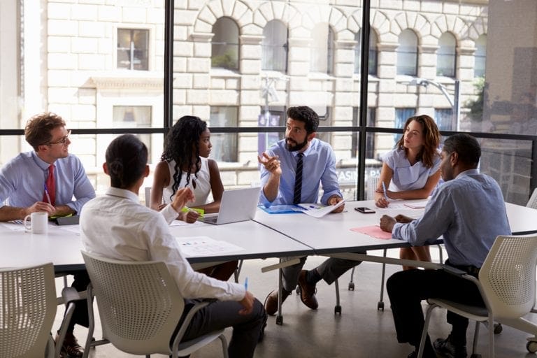 Corporate business team and manager in a meeting about buying a business, close up